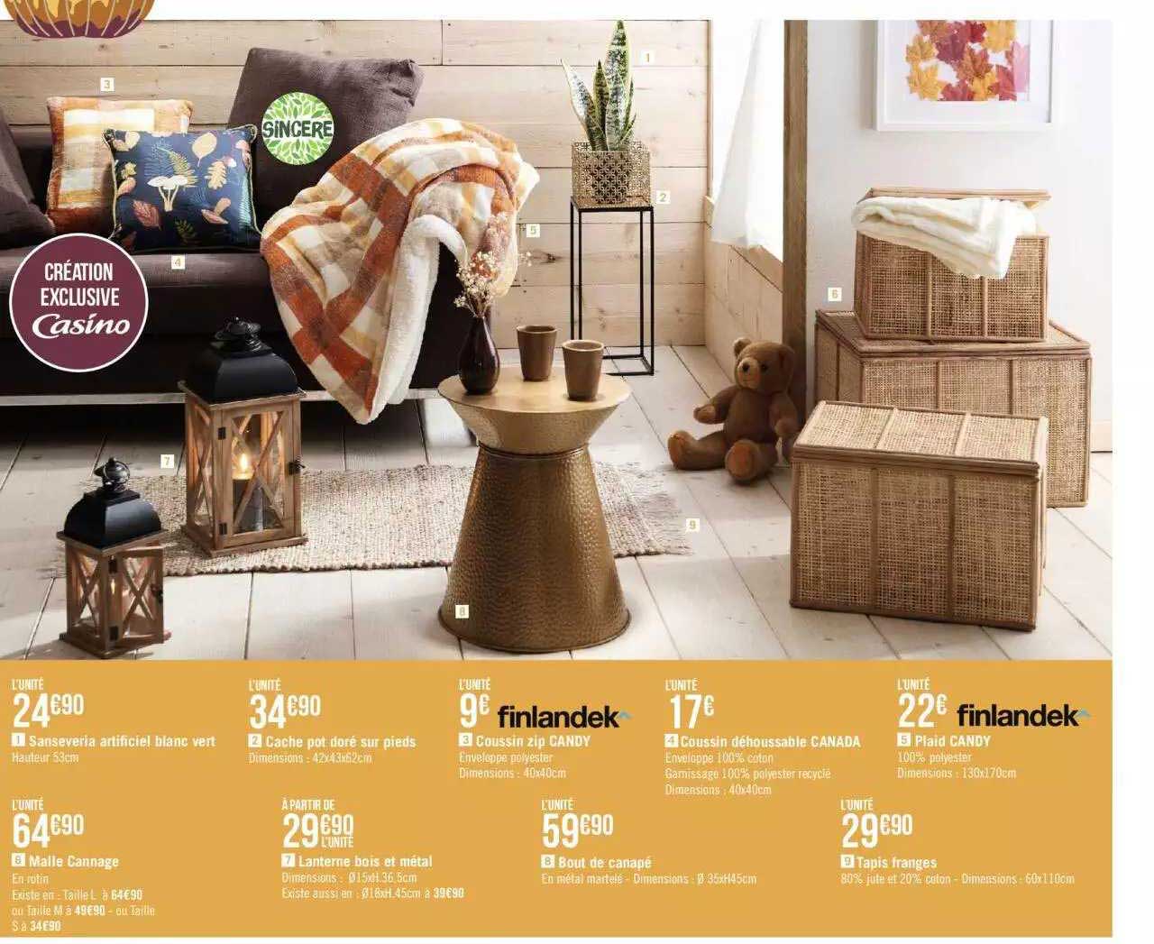 sanseveria artificiel blanc vert, malle cannage, cache pot doré sur pieds, lanterne bois et métal, coussin zip candy finlandek, bout de canapé, coussin déhoussable canada, tapis franges, plaid candy