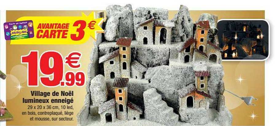 village de noël lumineux enneigé